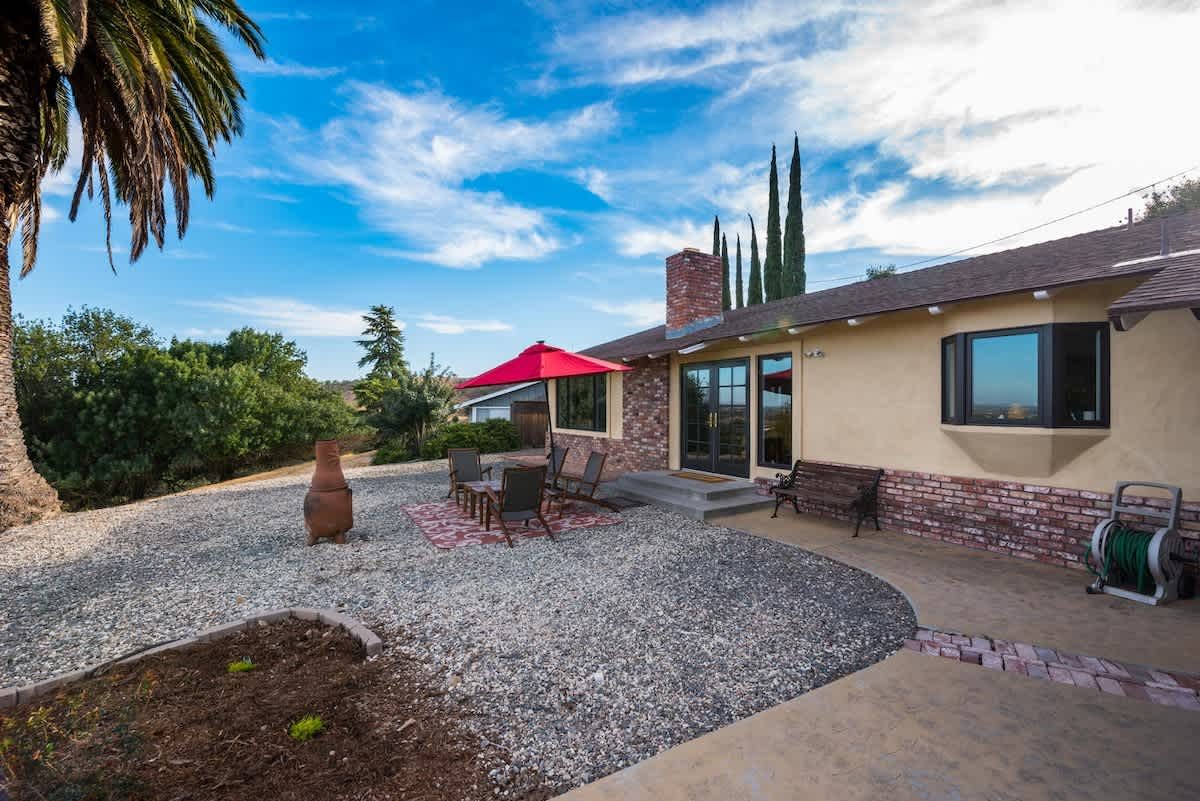 Patio with dining table and countryside views at Downtown Derby, a vacation rental on the west side of Paso Robles