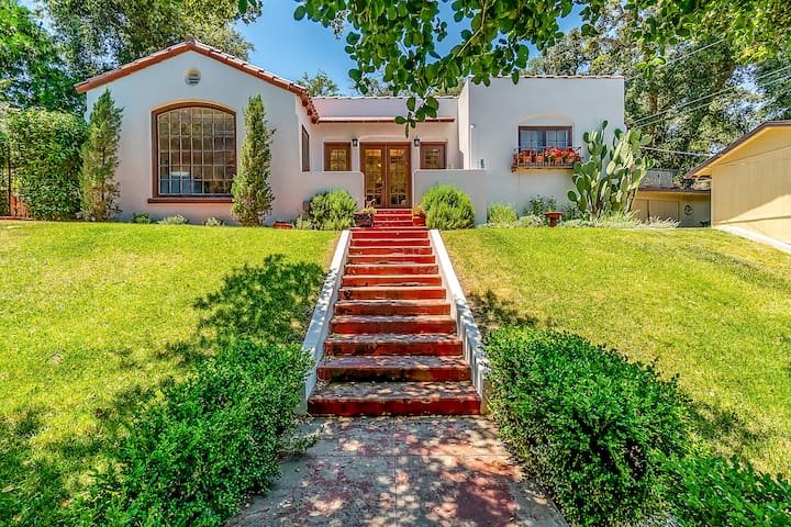 Spanish-style bungalow with tile roof and terracotta steps at Westside Spanish Bungalow, a vacation rental on Chestnut Street in Paso Robles
